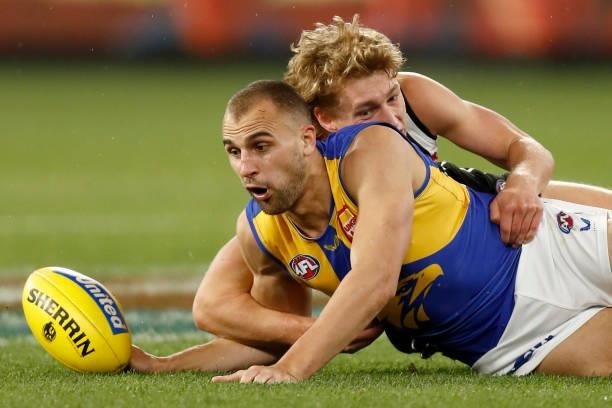 Finlay Macrae of the Magpies tackles Dom Sheed of the Eagles during the round 20 AFL match between Collingwood Magpies and West Coast Eagles at...
