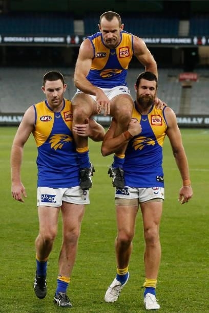 Shannon Hurn of the Eagles is chaired from the ground after playing in his 300th game during the round 20 AFL match between Collingwood Magpies and...