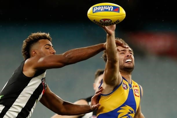 Issac Quaynor of the Magpies and Jack Petruccelle of the Eagles compete for the ball during the round 20 AFL match between Collingwood Magpies and...