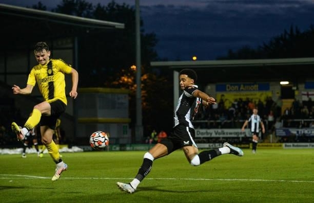 Jamal Lewis of Newcastle United crosses the ball during the Pre Season Friendly between Burton Albion and Newcastle United at the Pirelli Stadium on...
