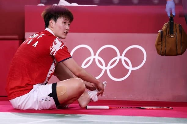 Chen Yu Fei of Team China receives medical treatment for her feet as she competes against He Bing Jiao of Team China during a Women's Singles...
