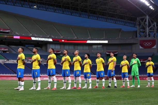 Players of Team Brazil stand for the national anthem prior to the Men's Quarter Final between Brazil and Egypt on day eight of the Tokyo Olympic...