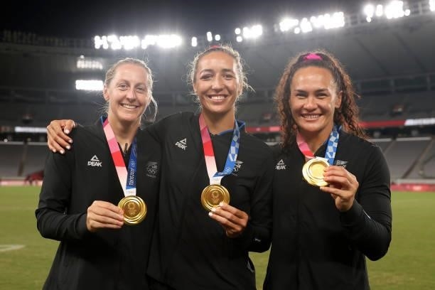 Gold medalists Kelly Brazier, Sarah Hirini and Portia Woodman of Team New Zealand celebrate with their gold medals after the Women’s Rugby Sevens...