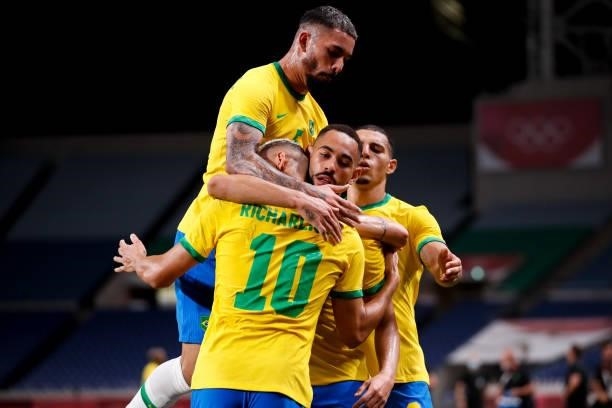 Matheus Cunha of Brazil celebrates his scoring with teammates in the Men's Quarterfinal match between Brazil and Egypt during the Tokyo 2020 Olympic...