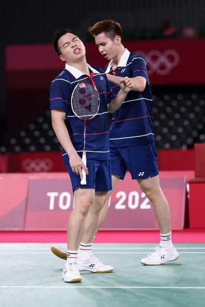Aaron Chia and Soh Wooi Yik of Team Malaysia react as they compete against Mohammad Ahsan and Hendra Setiawan of Team Indonesia during the Men’s...