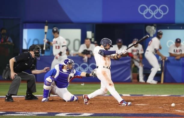 Eduardo Alvarez of Team United States hits a single in the fifth inning during the baseball opening round Group B game between Team South Korea and...