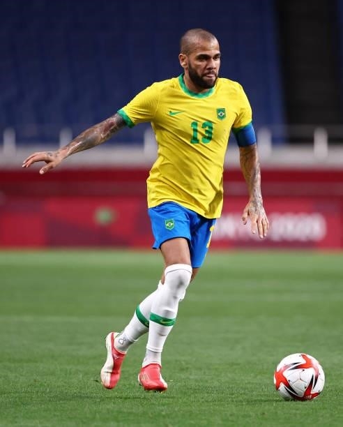 Dani Alves of Team Brazil runs with the ball during the Men's Quarter Final between Brazil and Egypt on day eight of the Tokyo Olympic Games at...
