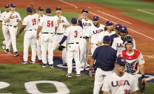 Tyler Austin of Team United States celebrates winning the match 4-2 with teammates during the baseball opening round Group B game between Team South...