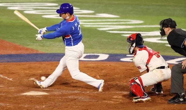 Ji Hwan Oh of Team South Korea swings out in the ninth inning during the baseball opening round Group B game between Team South Korea and Team United...