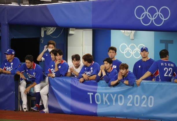 Team South Korea players look dejected in the ninth inning during the baseball opening round Group B game between Team South Korea and Team United...