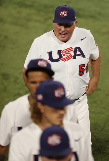 Mike Scioscia, Team manager of Team United States celebrates winning the match 4-2 during the baseball opening round Group B game between Team South...