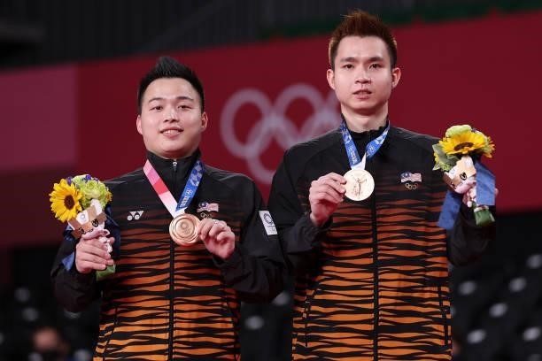 Bronze medalists Aaron Chia and Soh Wooi Yik of Team Malaysia pose on the podium during the medal ceremony for the Men’s Doubles badminton event on...