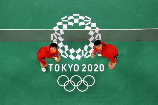 Gold medalists of Mix Doubles badminton event Wang Yi Lyu and Huang Dong Ping of Team China pose for photo on day eight of the Tokyo 2020 Olympic...