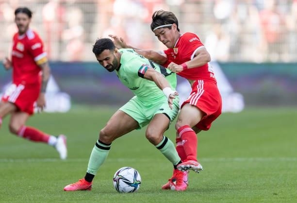 Mikel Balenziaga of Athletic Bilbao is challenged by Keita Endo of 1.FC Union Berlin during the pre-season friendly match between 1. FC Union Berlin...