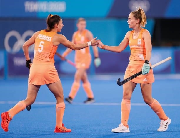 Malou Pheninckx and Pien Sanders of Team Netherlands interact during the Women's Preliminary Pool A match between Germany and Netherlands on day...
