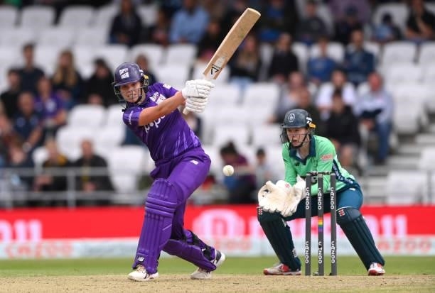 Invincibles wicketkeeper Sarah Bryce looks on as Superchargers batter Alice Davidson-Richards hits out during The Hundred match between Northern...