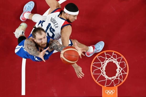 Patrik Auda of Team Czech Republic grabs a rebound over Devin Booker of Team United States during the second half of a Men's Basketball Preliminary...