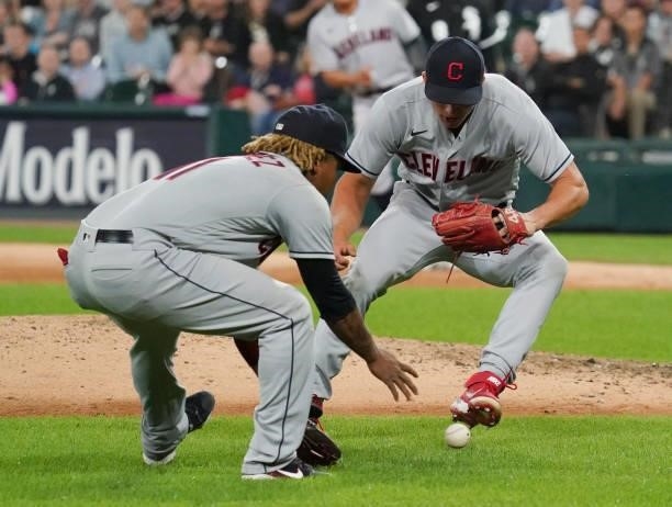 Jose Ramirez and James Karinchak of the Cleveland Indians are unable to make the play on the single by Cesar Hernandez of the Chicago White Sox...