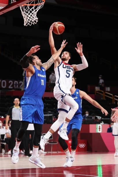 Zachary Lavine of Team United States drives to the basket against Blake Schilb of Team Czech Republic during the second half of a Men's Basketball...