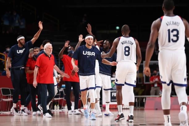 Devin Booker of Team United States congratulates his teammates following their vicory over the Czech Republic in a Men's Basketball Preliminary Round...