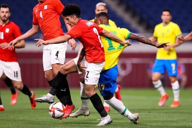 Ammar Hamdy of Egypt competes for the ball with Malcom of Brazil in the Men's Quarterfinal match between Brazil and Egypt during the Tokyo 2020...