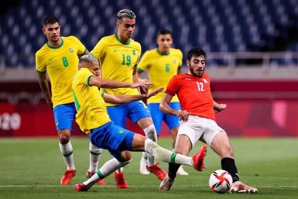 Akram Tawfik of Egypt competes for the ball with Richarlison of Brazil in the Men's Quarterfinal match between Brazil and Egypt during the Tokyo 2020...