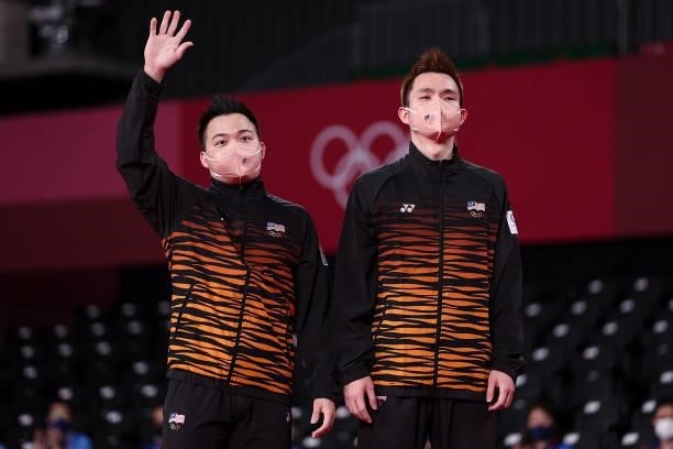 Bronze medalists Aaron Chia and Soh Wooi Yik of Team Malaysia pose on the podium during the medal ceremony for the Men’s Doubles badminton event on...