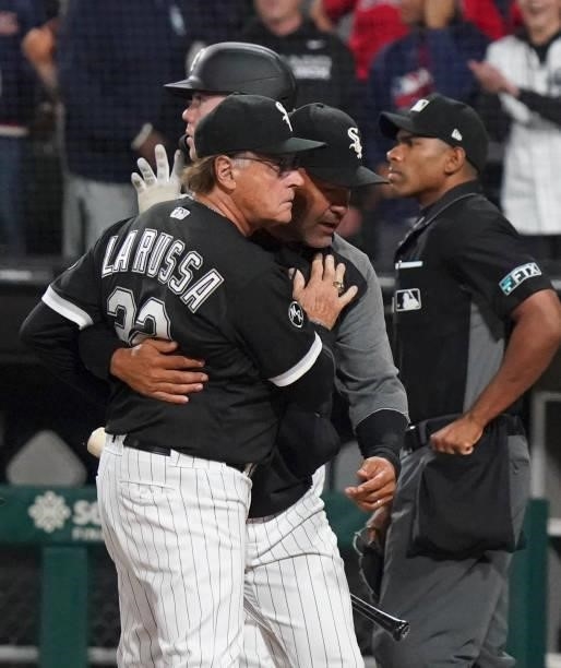 Manager Tony La Russa of the Chicago White Sox is held back by bench coach Miguel Cairo during the eighth inning at Guaranteed Rate Field on July 30,...