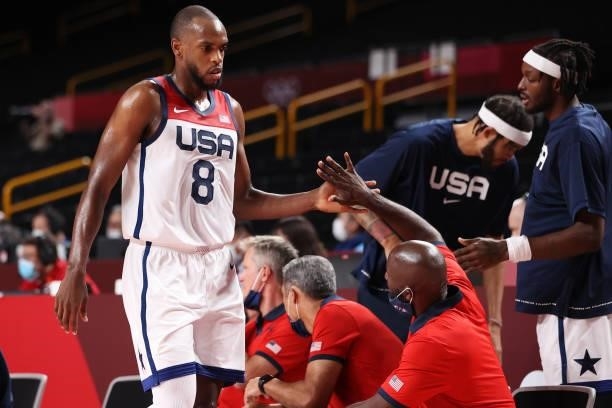 Khris Middleton of Team United States gets a high-five as he makes his way to the bench during the second half of a Men's Basketball Preliminary...