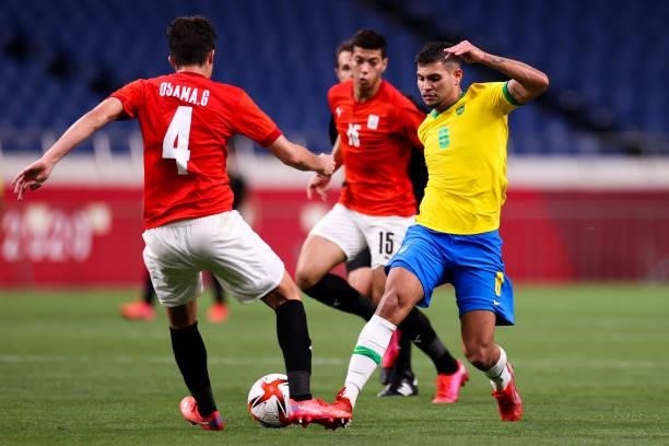 Bruno Guimaraes of Brazil competes for the ball with Ricardo Graca of Egypt in the Men's Quarterfinal match between Brazil and Egypt during the Tokyo...