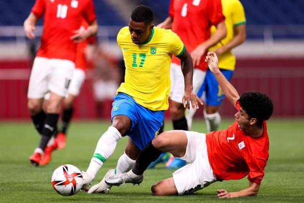 Malcom of Brazil competes for the ball with Ammar Hamdy of Egypt in the Men's Quarterfinal match between Brazil and Egypt during the Tokyo 2020...