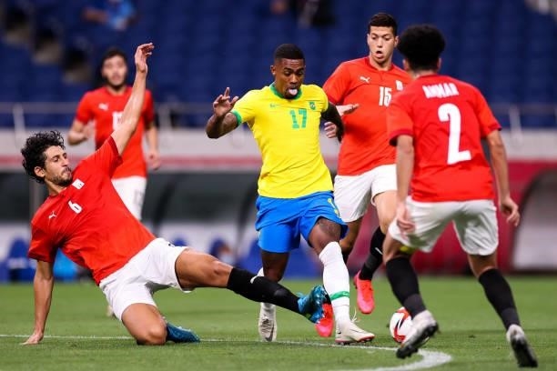 Malcom of Brazil competes for the ball with Ahmed Hegazy of Egypt in the Men's Quarterfinal match between Brazil and Egypt during the Tokyo 2020...