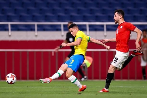 Paulinho of Brazil pass the ball in the Men's Quarterfinal match between Brazil and Egypt during the Tokyo 2020 Olympic Games at Saitama Stadium on...