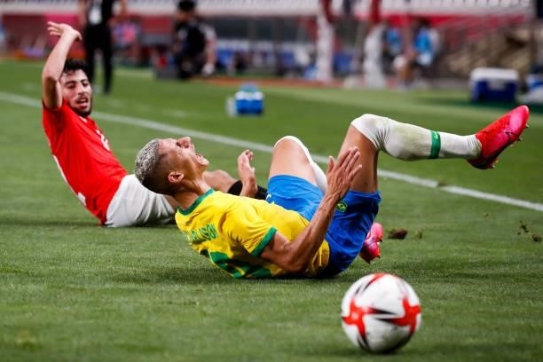 Richarlison of Brazil competes for the ball with Akram Tawfik of Egypt in the Men's Quarterfinal match between Brazil and Egypt during the Tokyo 2020...