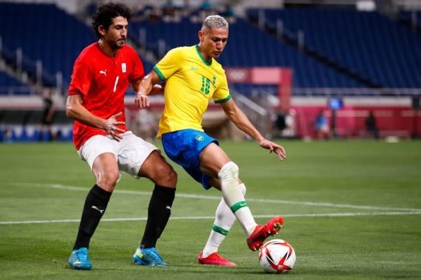 Richarlison of Brazil competes for the ball with Ahmed Hegazy of Egypt in the Men's Quarterfinal match between Brazil and Egypt during the Tokyo 2020...