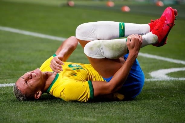 Richarlison of Brazil injured in the Men's Quarterfinal match between Brazil and Egypt during the Tokyo 2020 Olympic Games at Saitama Stadium on July...