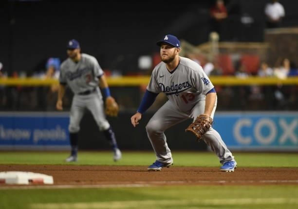 Max Muncy of the Los Angeles Dodgers gets ready to make a play at first base against the Arizona Diamondbacks at Chase Field on July 30, 2021 in...