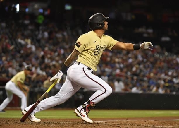 David Peralta of the Arizona Diamondbacks follows through on a swing against the Los Angeles Dodgers at Chase Field on July 30, 2021 in Phoenix,...