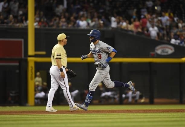 Chris Taylor of the Los Angeles Dodgers rounds the bases after hitting a solo home run against the Arizona Diamondbacks during the sixth inning at...