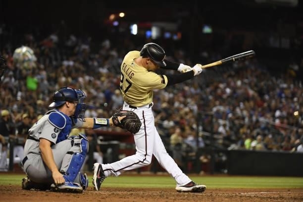 Drew Ellis of the Arizona Diamondbacks hits his first MLB single against the Los Angeles Dodgers during the sixth inning at Chase Field on July 30,...