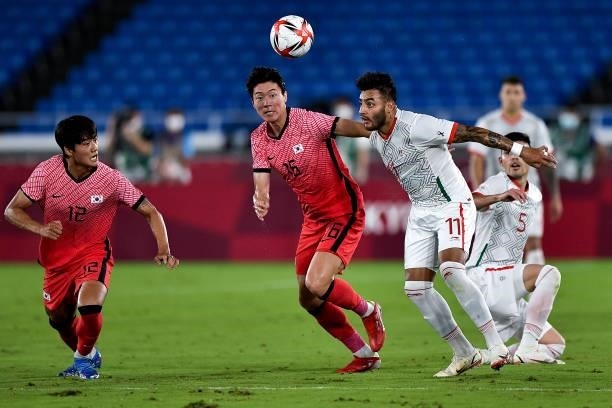 Ui-jo Hwang of South Korea and Ernesto Vega of Mexico during the Men's Football Tournament Quarter Final match between South Korea and Mexico on day...