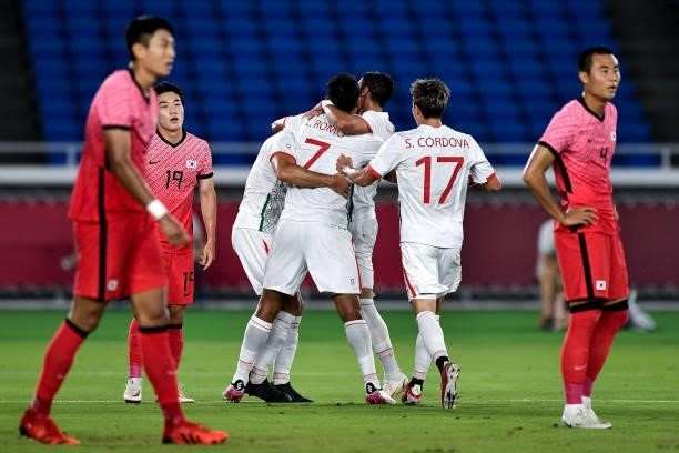 Henry Martin of Mexico celebrates with teammates after scoring his side's first goal during the Men's Football Tournament Quarter Final match between...