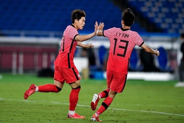 Dong-gyeong Lee of South Korea celebrates after scoring his sides second goal with Jin-ya Kim of South Korea during the Men's Football Tournament...