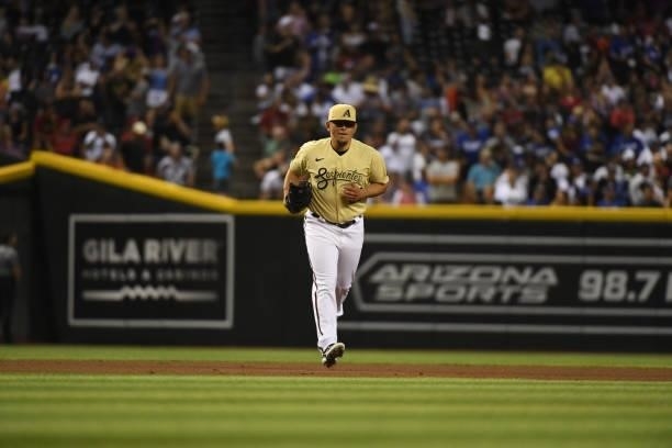 Miguel Aguilar of the Arizona Diamondbacks runs onto the filed against the Los Angeles Dodgers during the seventh inning at Chase Field on July 30,...