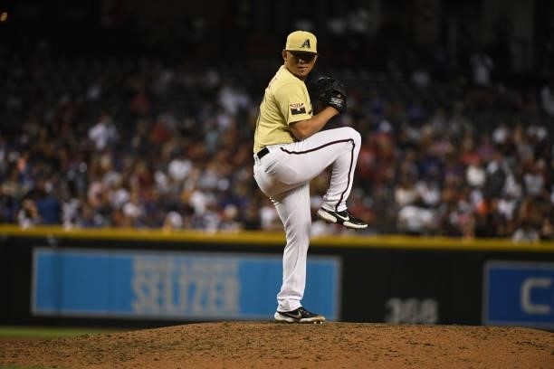 Miguel Aguilar of the Arizona Diamondbacks delivers a pitch against the Los Angeles Dodgers during the seventh inning at Chase Field on July 30, 2021...