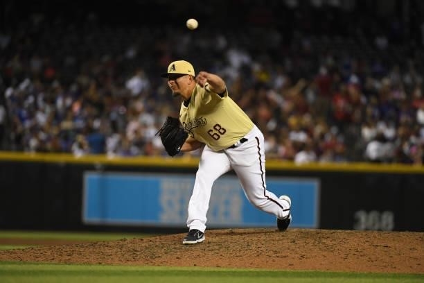 Miguel Aguilar of the Arizona Diamondbacks delivers a pitch against the Los Angeles Dodgers during the seventh inning at Chase Field on July 30, 2021...