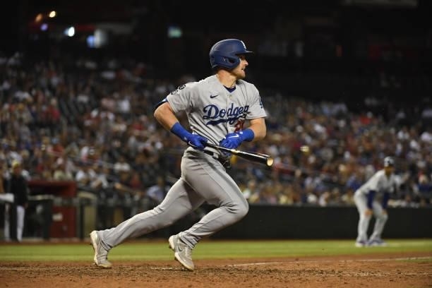 Billy McKinney of the Los Angeles Dodgers follows though on a swing against the Arizona Diamondbacks at Chase Field on July 30, 2021 in Phoenix,...