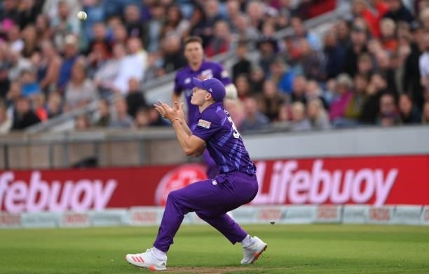 Superchargers fielder Matthew Potts steadies himself to take the catch of Laurie Evans during The Hundred match between Northern Superchargers Men...