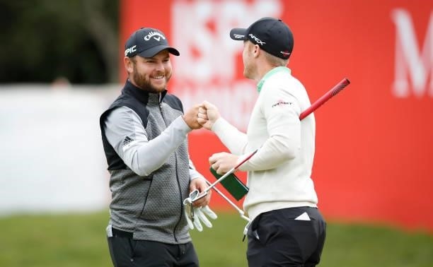 Jordan Smith and David Horsey of England on the 18th green during day three of the ISPS HANDA World Invitational at Galgorm Spa & Golf Resort on July...