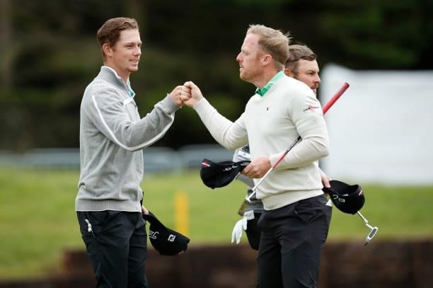 Daniel Hillier of Australia and David Horsey of England on the 18th green during day three of the ISPS HANDA World Invitational at Galgorm Spa & Golf...